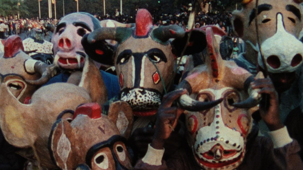 crowd of people in paper machee masks